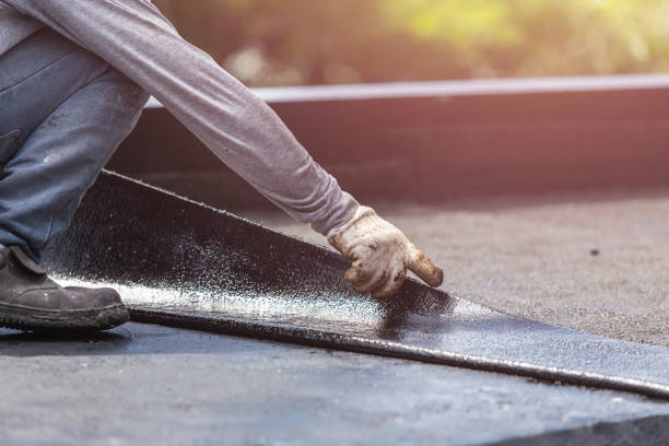 Professional Waterproofing technician working in Napoleon, MI